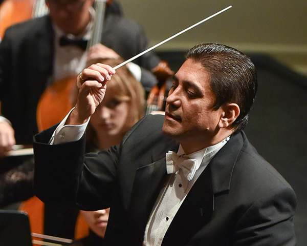 German Gutierrez conducting an orchestra