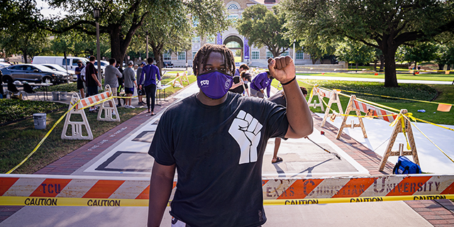 TCU student Kellton Hollins with his End Racism mural project