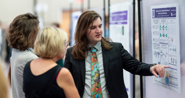 Student presenting at TCU's research fair
