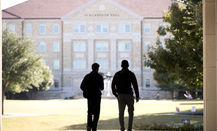 Two male students walking to class