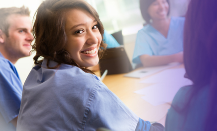 Female medical student in lab coat