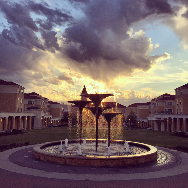 Dramatic sunset behind Frog Fountain