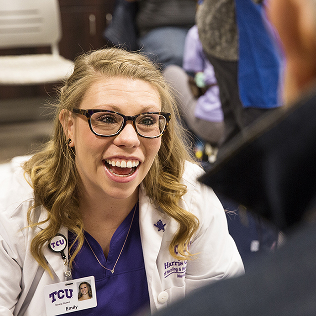 A student from the TCU nursing program engaged in community work