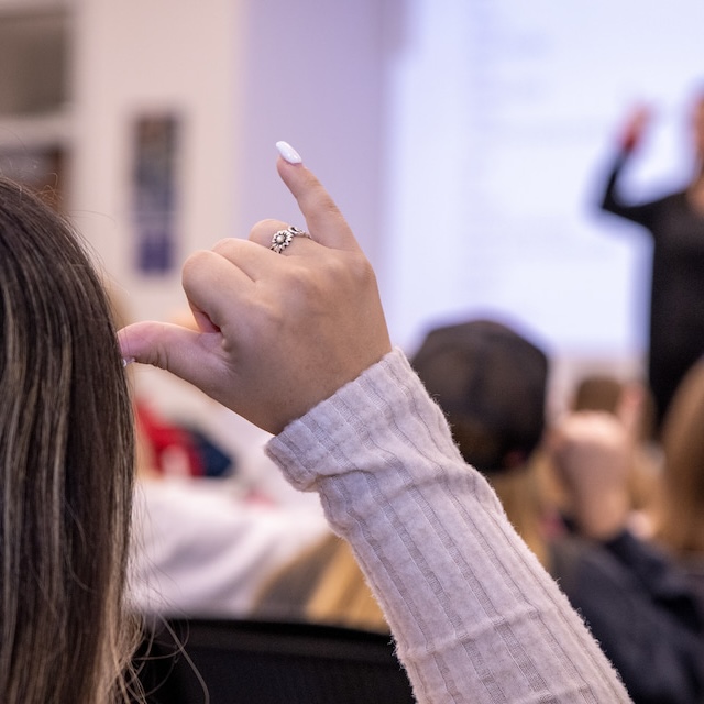 Student mirroring teacher in ASL