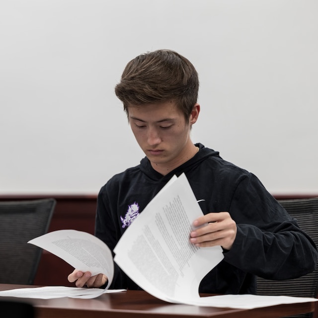 Student reads through essay