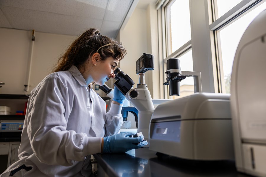 researcher with microscope