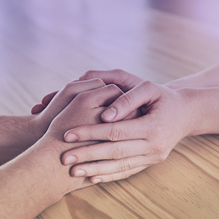 Reassuring hands of counseling staff with student