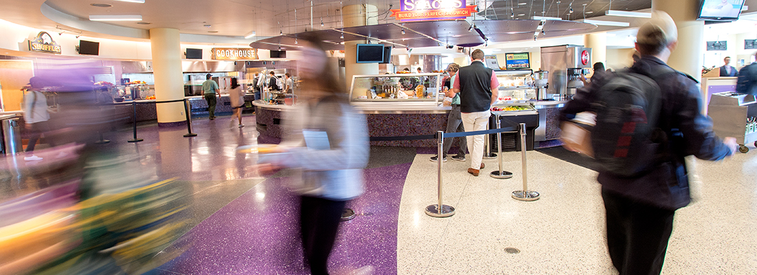 Busy students create a blur making their way through Market Square, the main TCU campus dining hall. 