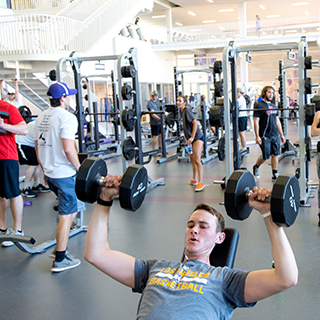 TCU rec center is busy with dozens of students using the weights and equipment The TCU rec center is busy with dozens of students using the weights and equipment