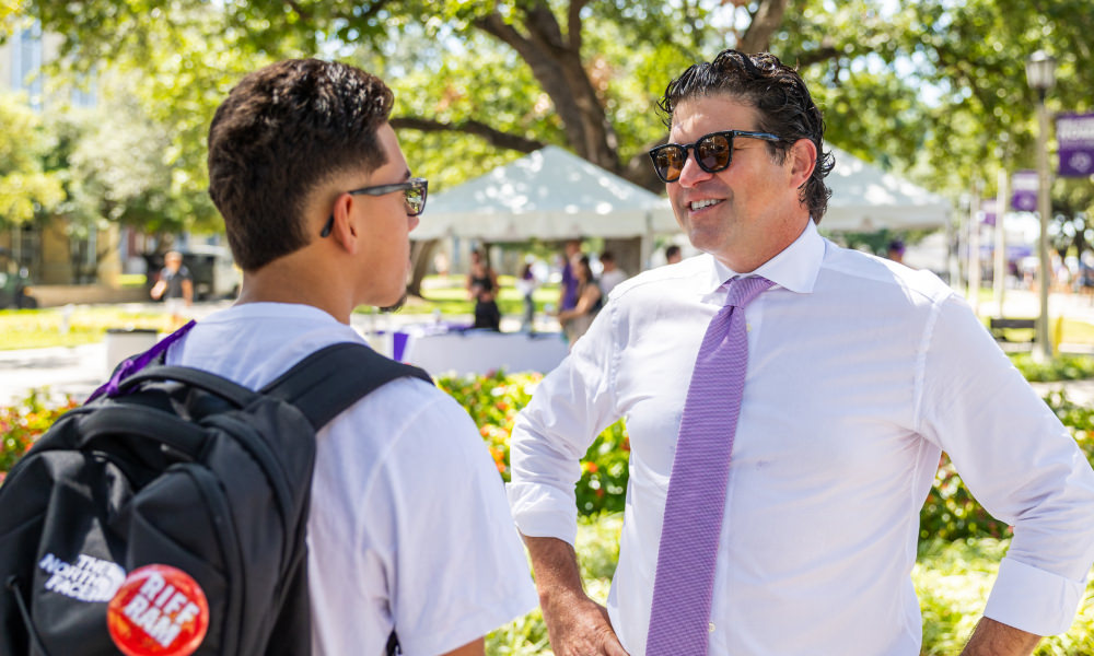 Chancellor Pullin talking to student
