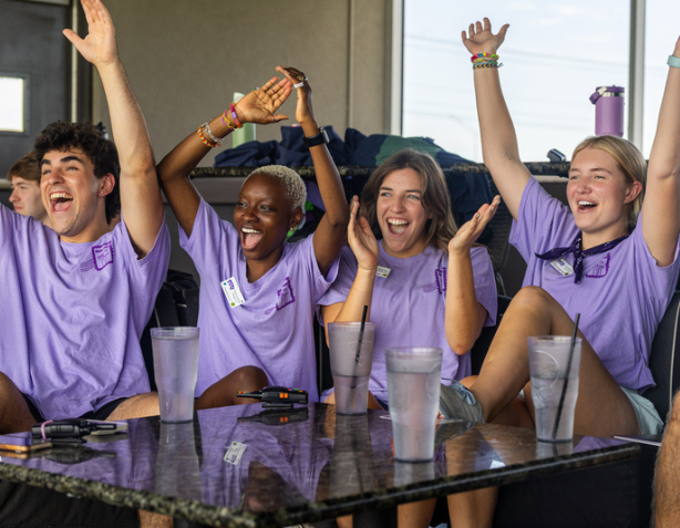 Students on campus lounging in hammocks