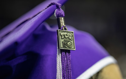 Commencement mortarboard cap with TCU 150 charm on tassel