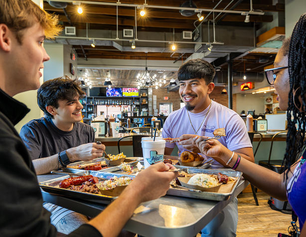 A group of TCU students enjoy a meal together at a local restaurant