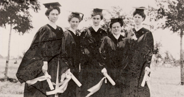 Group of four female graduates from early days of TCU