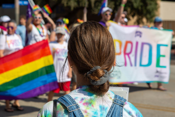 Person watching a pride parade