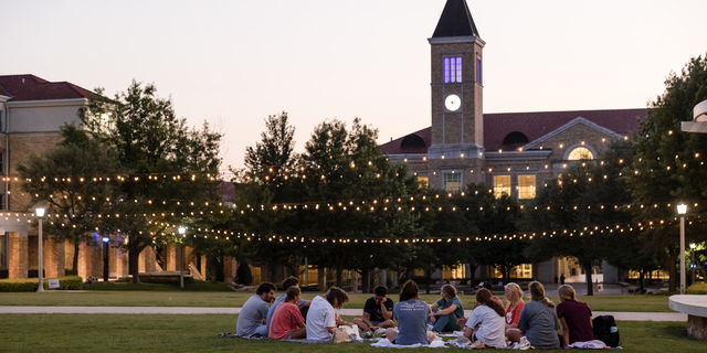 Students sit in the Campus Commons