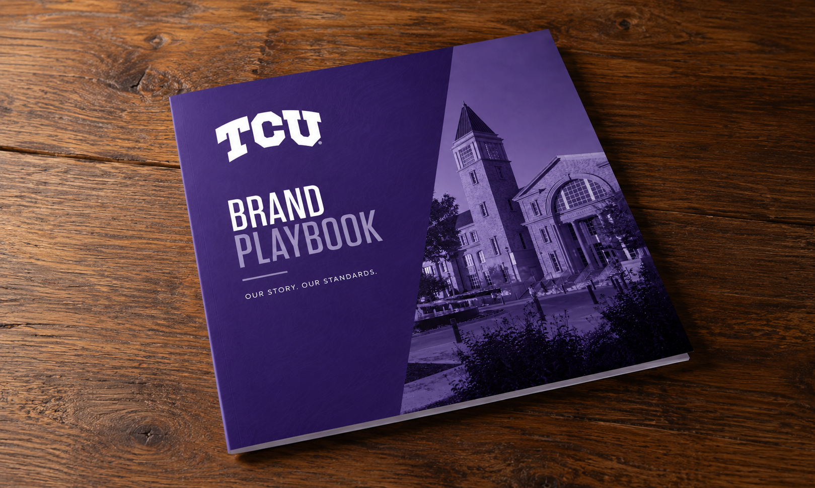 a brand playbook sitting on a wooden tabletop