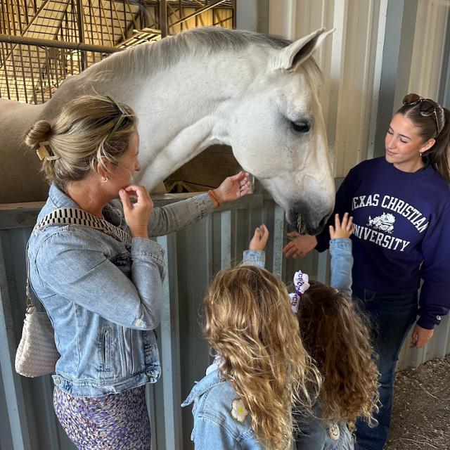 Family Visits TCU Equestrian stables