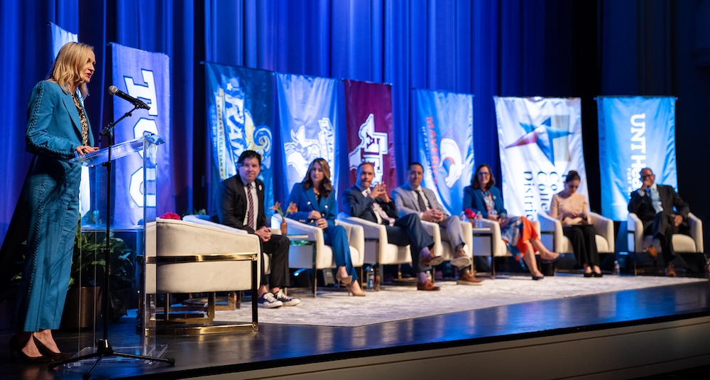 Higher Education panel seated onstage
