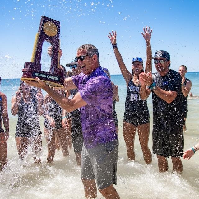 Mike Buddie celebrates with beach volleyball