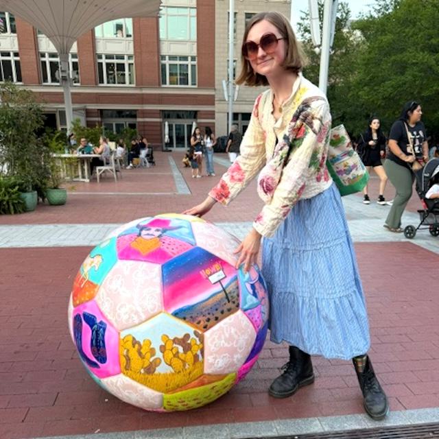 Caya Crum with soccer ball art