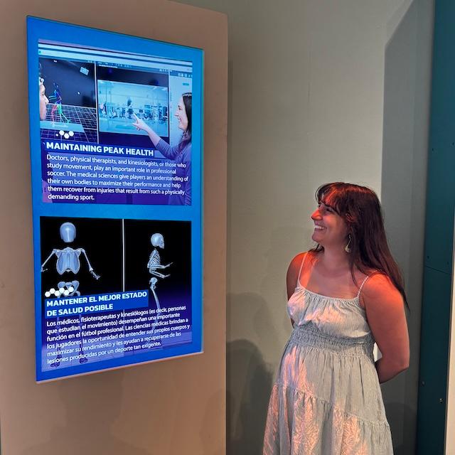 Emily Haag looks at exhibit screens