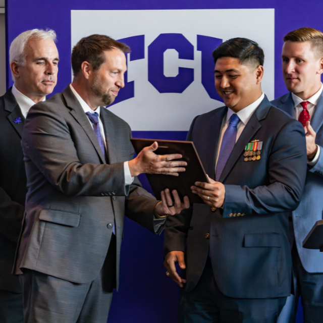Austin Boonyachai receives the first Major Horace S. Carswell Jr. Memorial Award.&nbsp;
