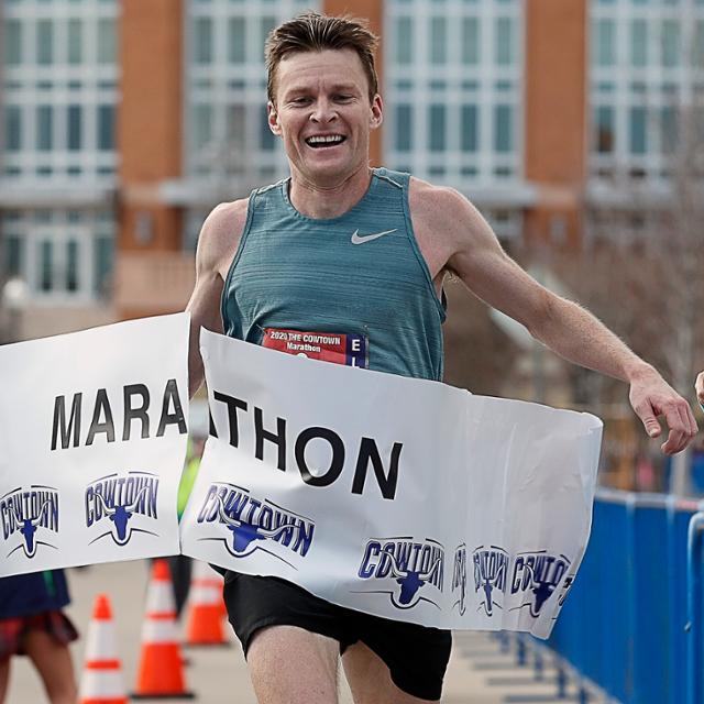 Joe Darda, assistant professor of English, wins the Cowtown Marathon (Photo by Bob Booth, courtesy of the Star-Telegram)