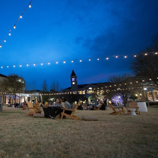 Campus Commons with Students at Night