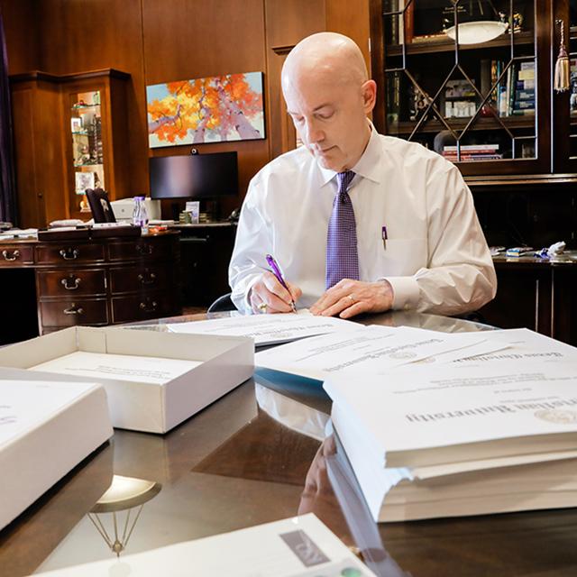 Chancellor Victor Boschini signs every TCU diploma by hand.