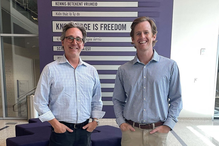 Shawn Farrell and Greg Cox standing in the lobby of Rees-Jones Hall
